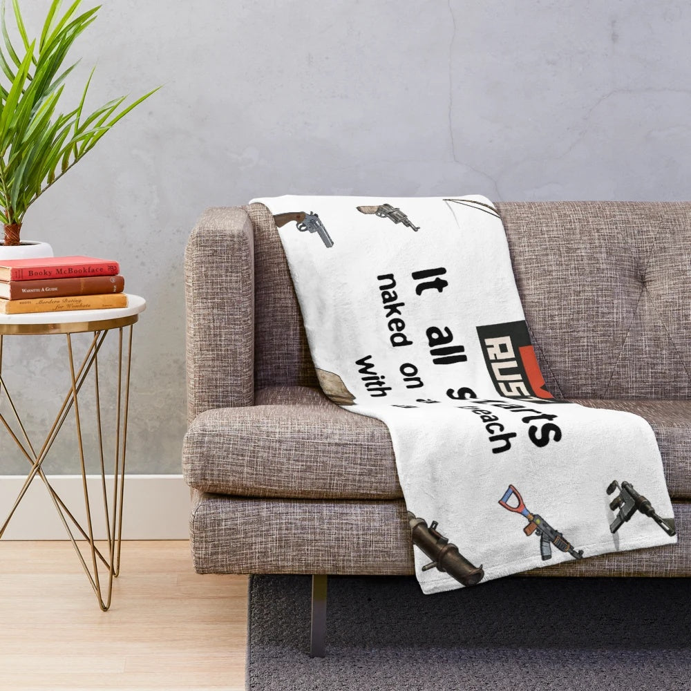 Rust-inspired plush blanket featuring a naked character on a beach