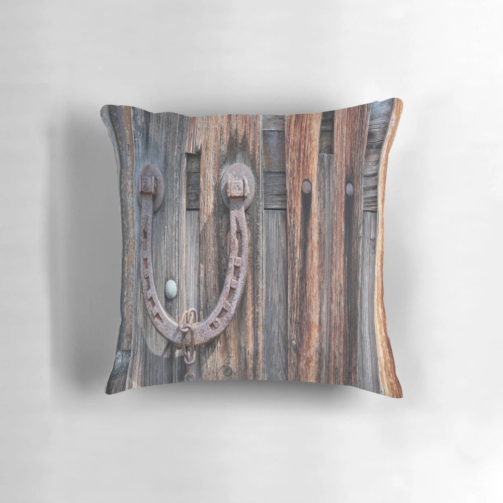 Rustic barn wood pillow with distressed equestrian horseshoe design