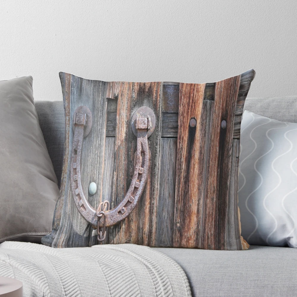 Rustic barn wood pillow with distressed equestrian horseshoe design