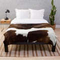 Rustic cow print plush blanket for cozy, modern home decor