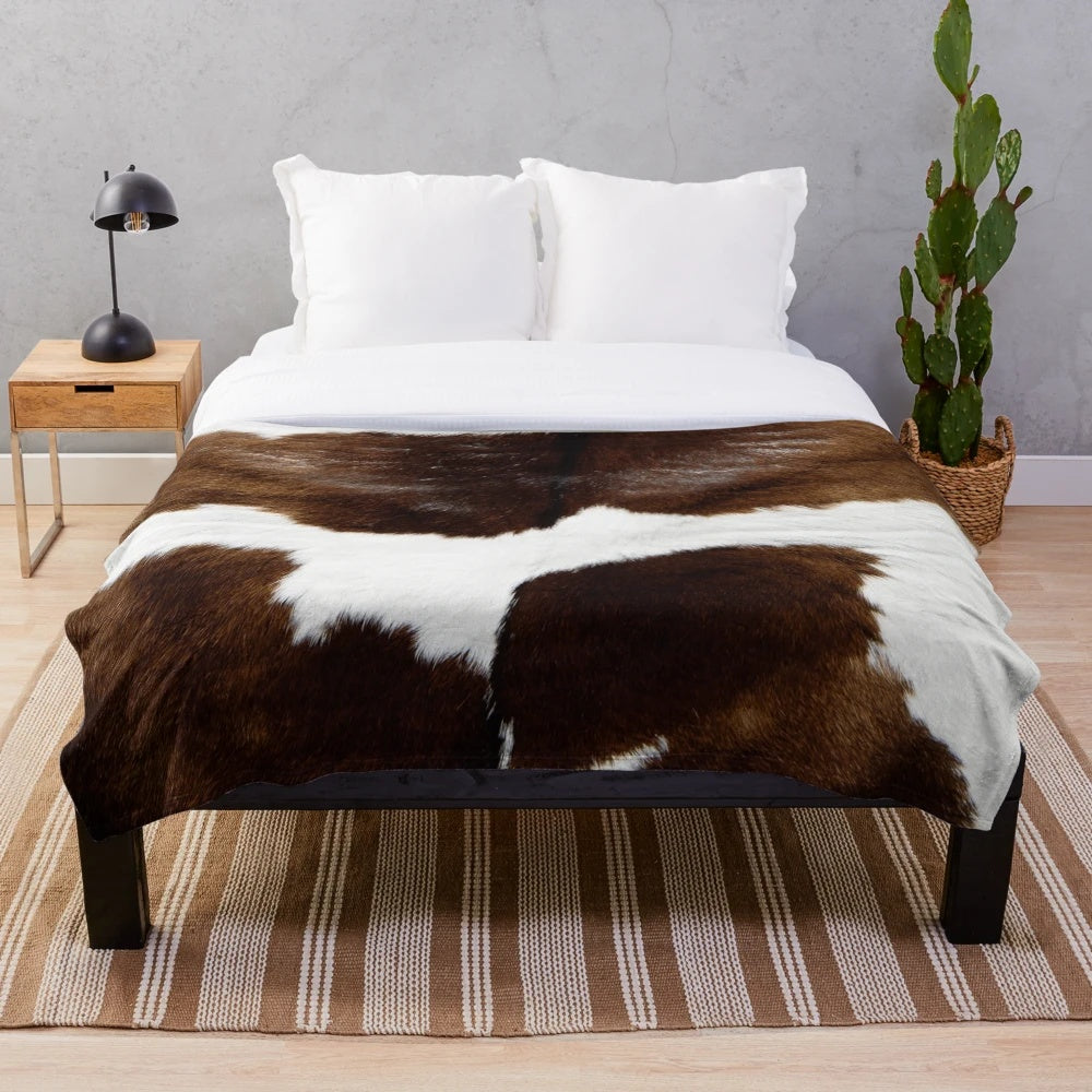 Rustic cow print plush blanket for cozy, modern home decor