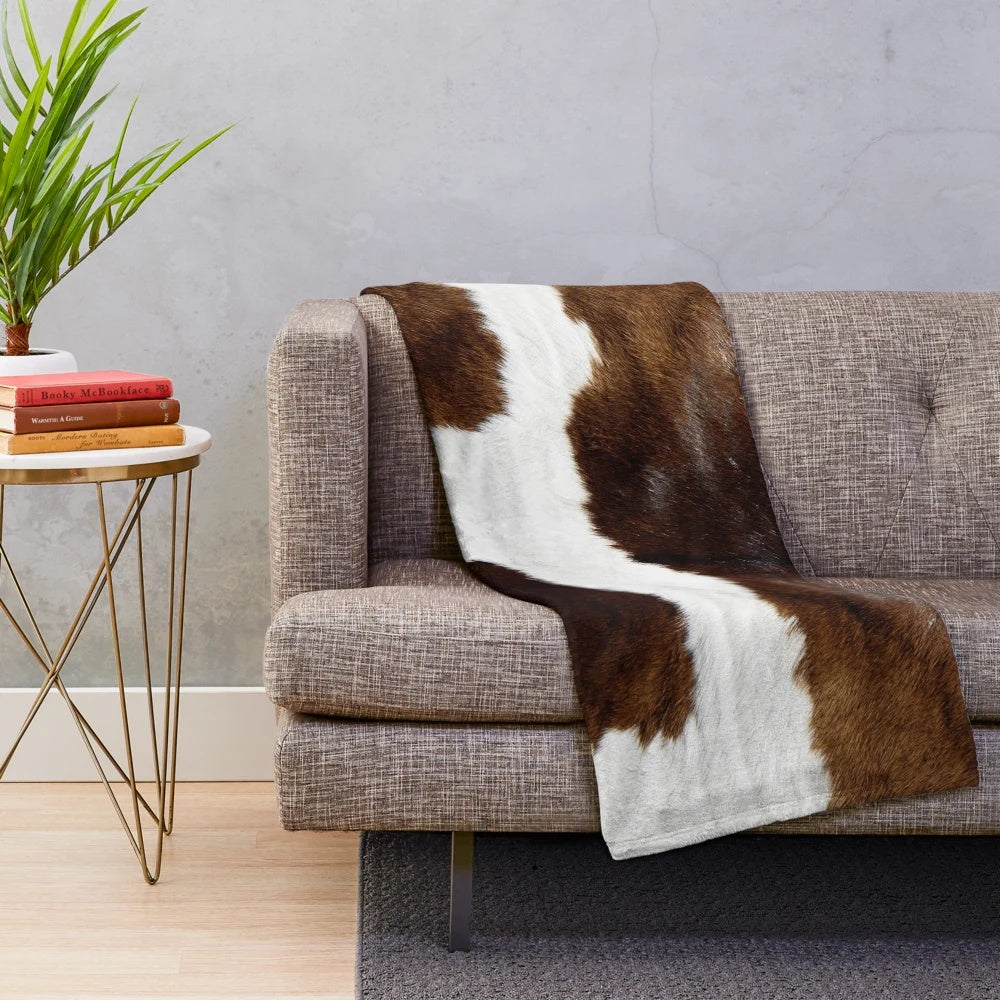 Rustic cow print plush blanket for cozy, modern home decor