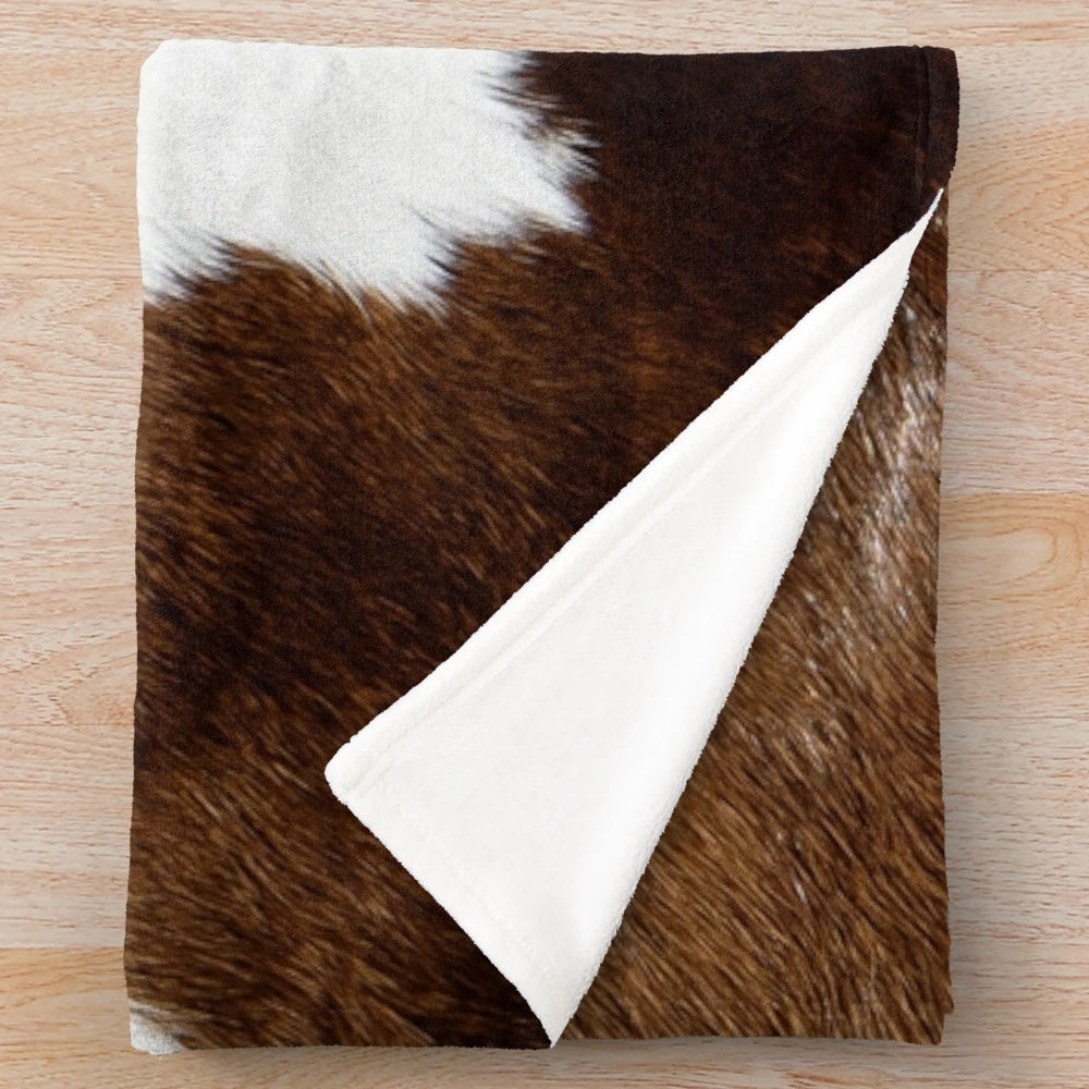 Rustic cow print plush blanket for cozy, modern home decor