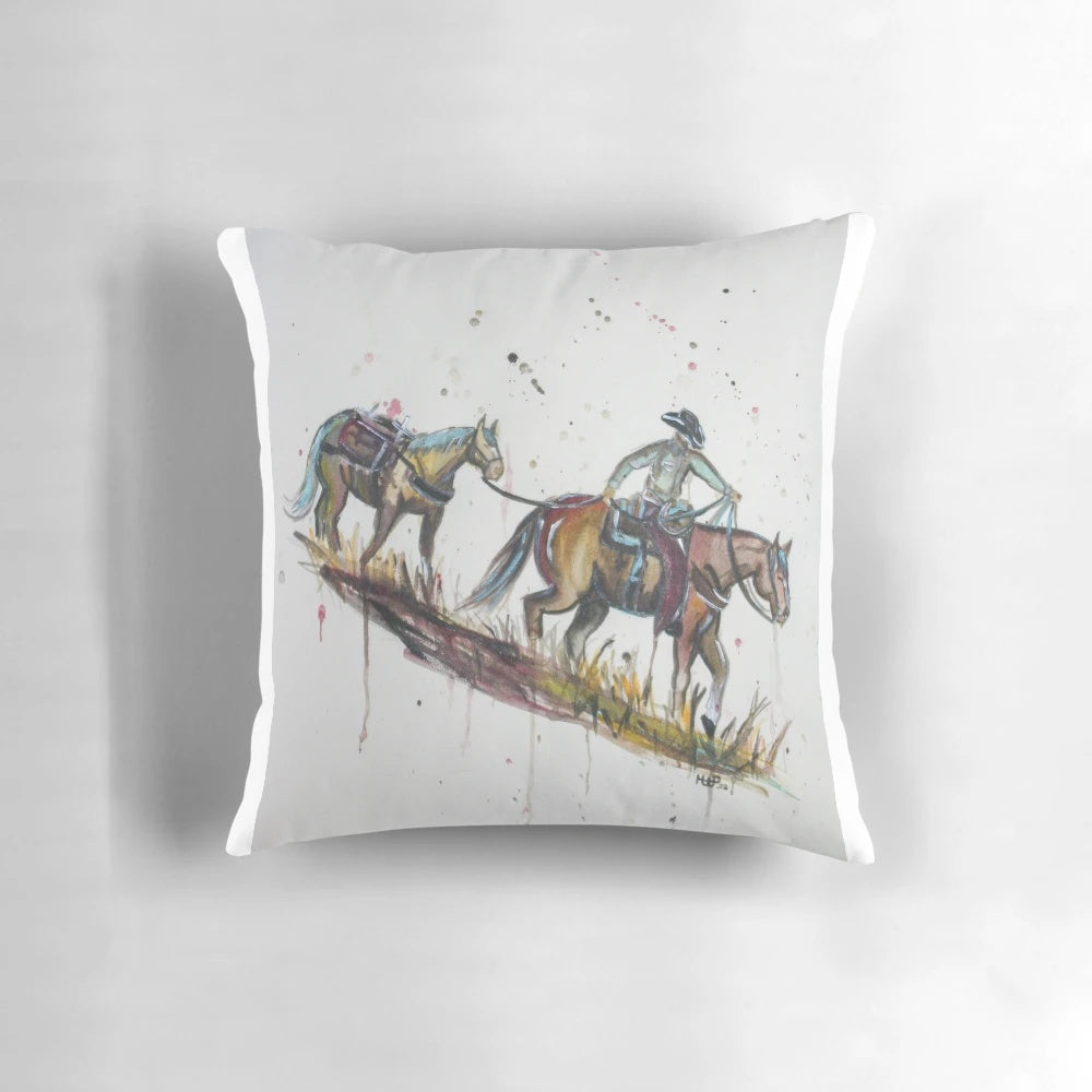 Cowboy packing on a pillow with abstract western motif