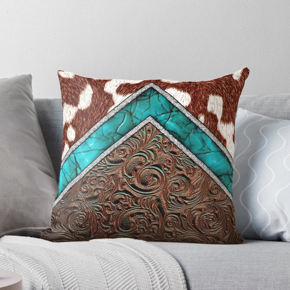 Cowhide and tooled leather pillow with a western cowgirl pattern in turquoise and brown tones