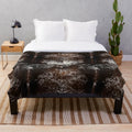 Cowhide-patterned plush blanket for rustic, farmhouse, or western-inspired home decor
