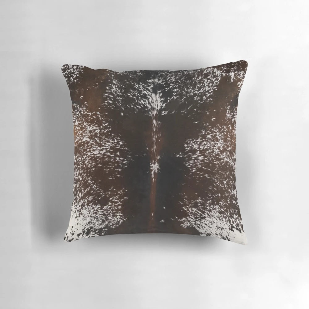 Cowhide tan brown and white decorative pillow with a western or country style design