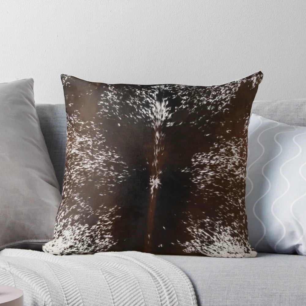 Cowhide tan brown and white decorative pillow with a western or country style design