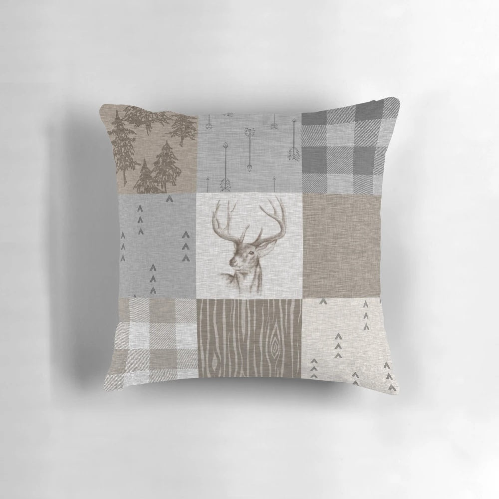 Rustic deer patchwork pattern pillow with neutral colors and woodland motifs