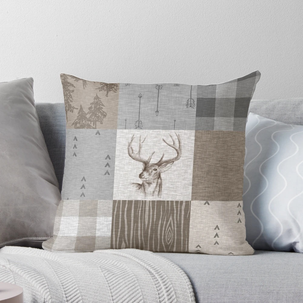 Rustic deer patchwork pattern pillow with neutral colors and woodland motifs