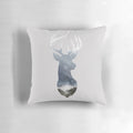 A soft, decorative pillow featuring a serene deer silhouette in a misty forest landscape.
