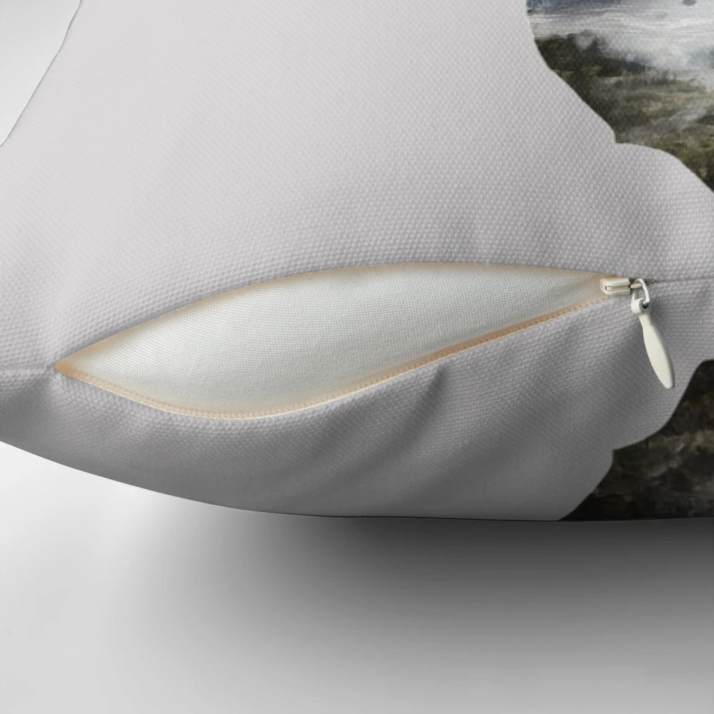 A soft, decorative pillow featuring a serene deer silhouette in a misty forest landscape.