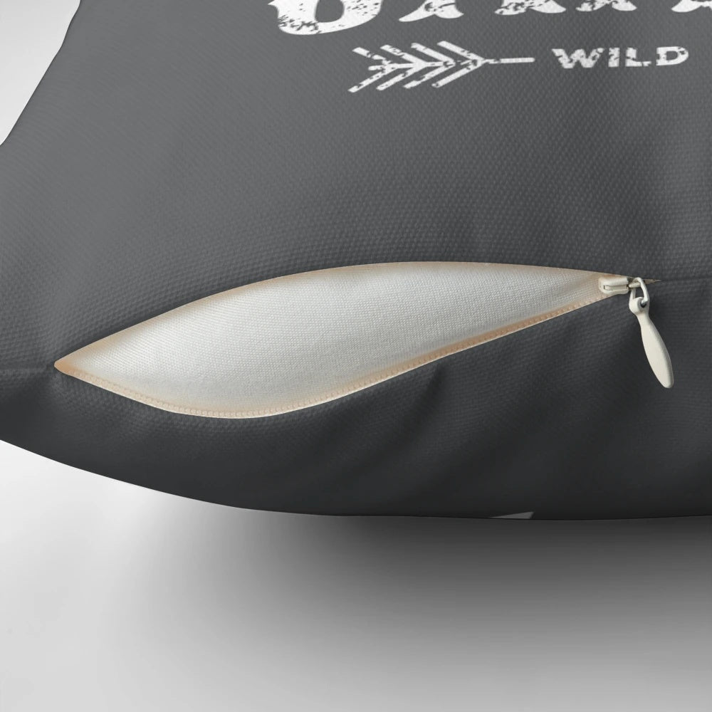 Rustic distressed white pillow with camping and nature-inspired design