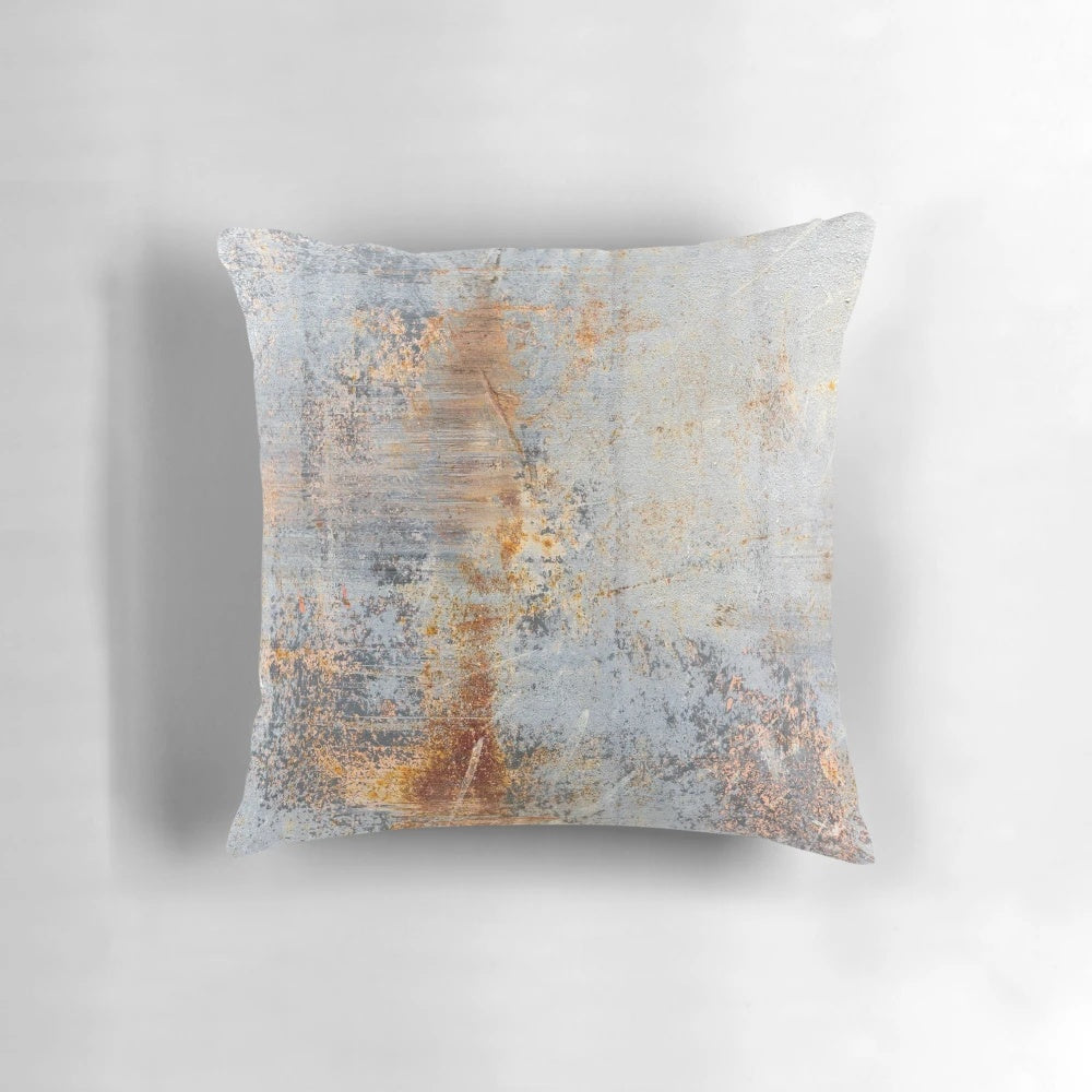 Rustic, distressed pillow with an aged, weathered metal texture
