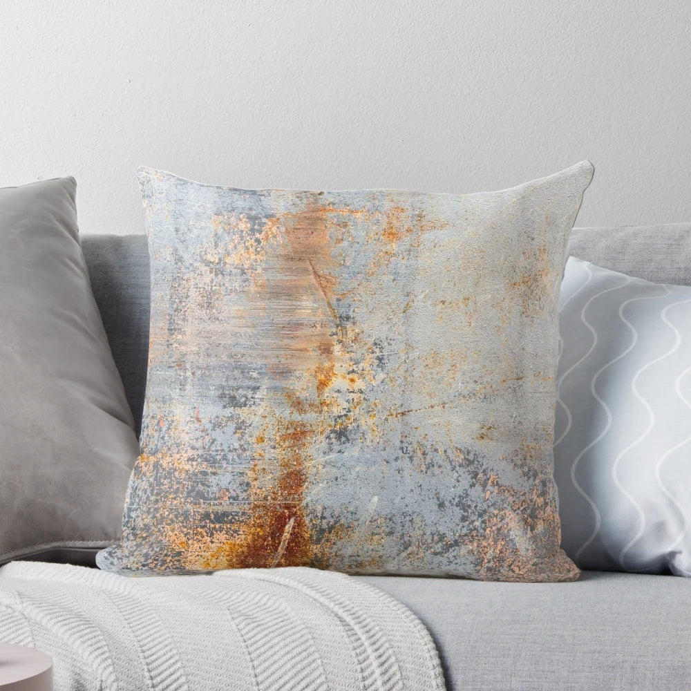 Rustic, distressed pillow with an aged, weathered metal texture