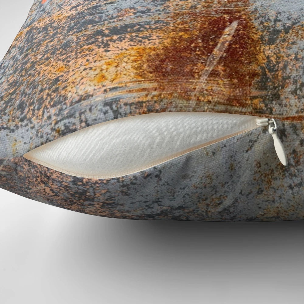 Rustic, distressed pillow with an aged, weathered metal texture