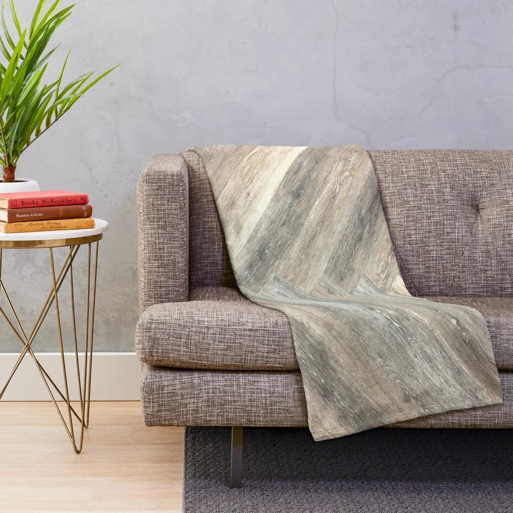 Rustic farmhouse plush blanket with neutral tones and warm, cozy texture