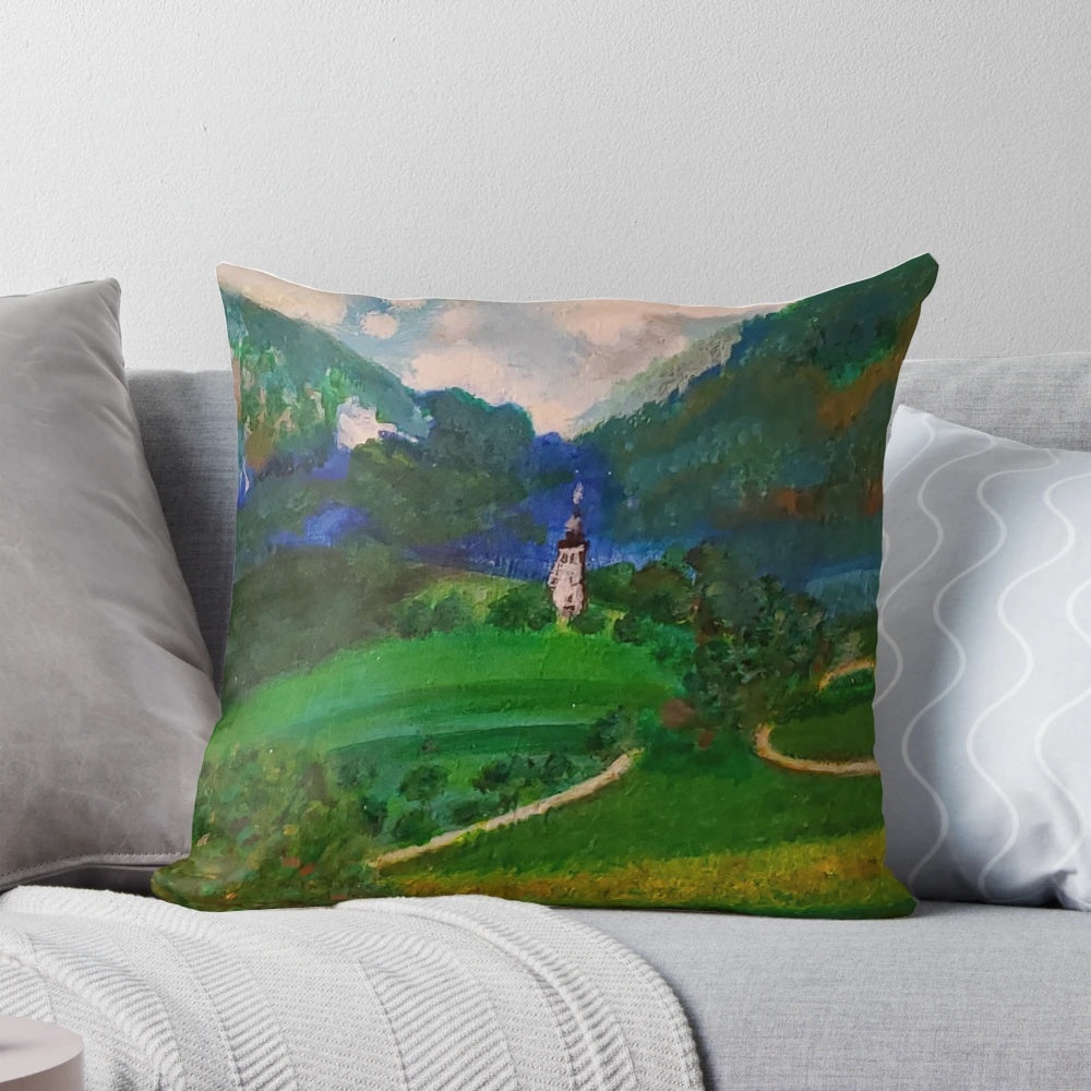 A plush, decorative pillow featuring a charming French countryside landscape with a blue tower, fluffy clouds, and lush greenery.