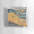 Harvest landscape pillow featuring cottages, birds, and wildlife in a golden countryside scene