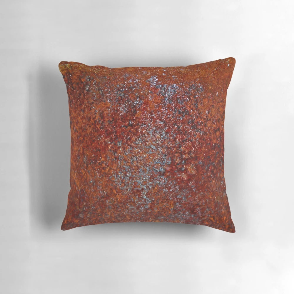 Rusted metallic pillow with industrial, vintage appeal