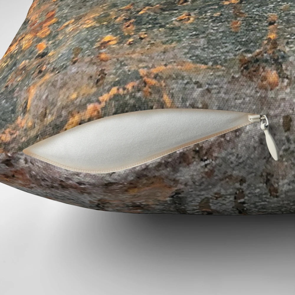 A rusty, metallic pillow with a textured, grungy appearance, perfect for industrial-style home decor.