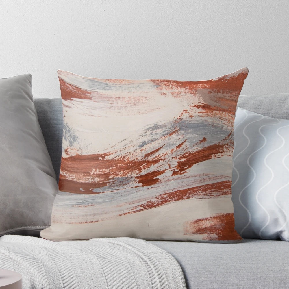 Rustic metallic pillow with oxidized, earthy tones in shades of rust, slate, and white