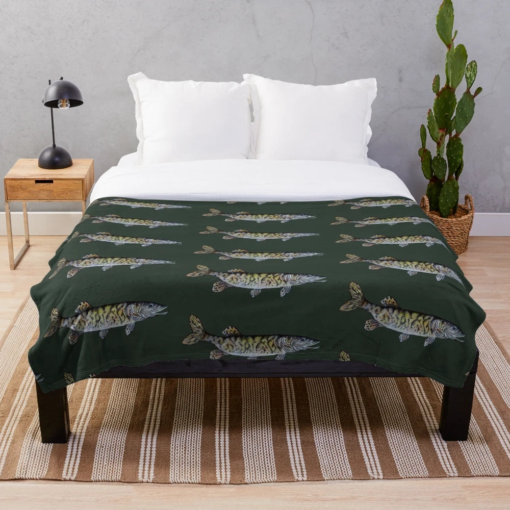 Musky fish drawing on a dark green plush blanket