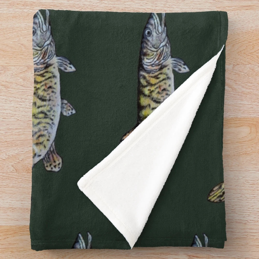 Musky fish drawing on a dark green plush blanket
