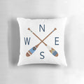 Rustic nautical compass and oar design printed on a cozy throw pillow, perfect for lake house, coastal, and boho-inspired home decor.