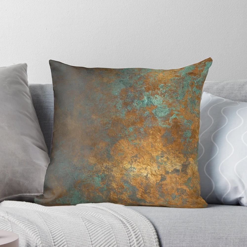 Oxidized copper pillow with a unique, metallic finish for a modern, industrial-inspired home.
