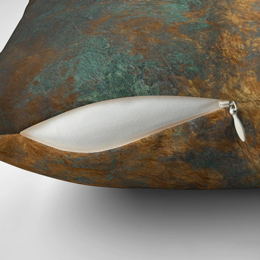 Oxidized copper pillow with a unique, metallic finish for a modern, industrial-inspired home.