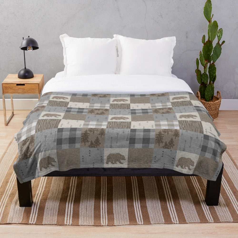 Rustic patchwork plush blanket with bear design for cozy woodland retreats