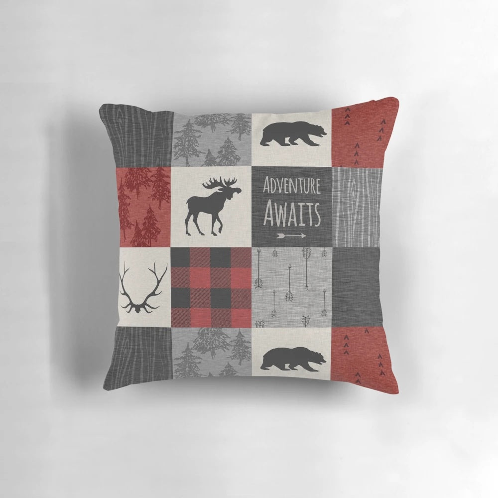 Cozy rustic patchwork pillow in red and black with wildlife motifs