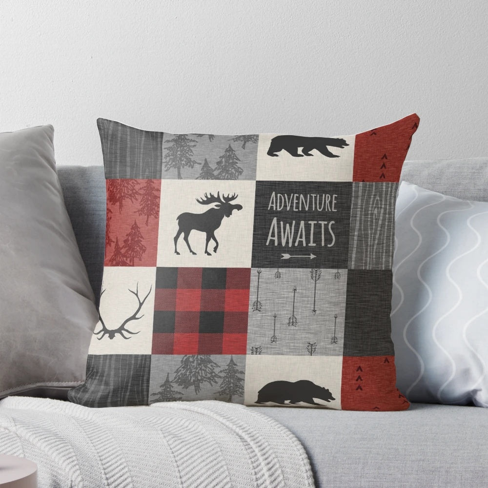 Cozy rustic patchwork pillow in red and black with wildlife motifs