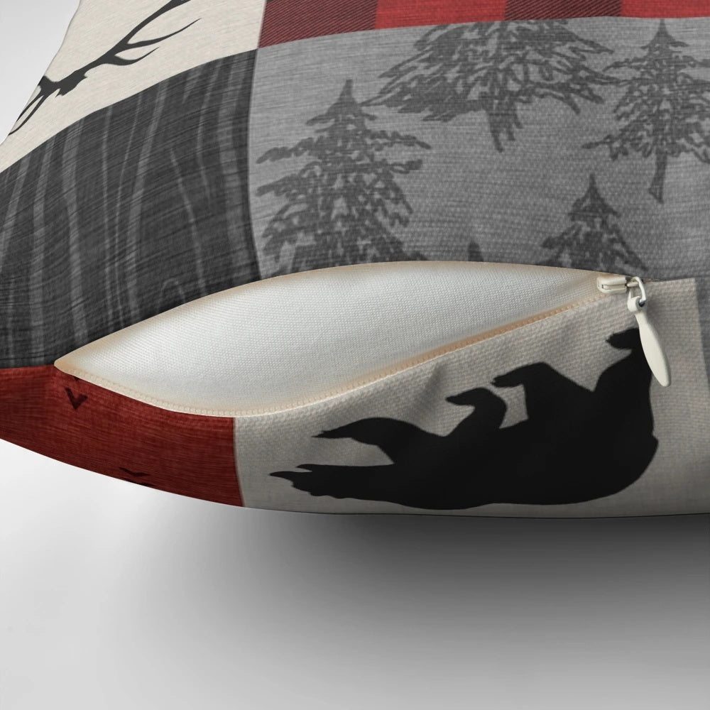 Cozy rustic patchwork pillow in red and black with wildlife motifs