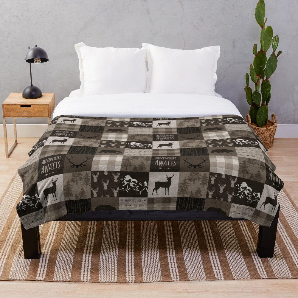 Rustic plush blanket with patchwork wildlife and adventure design
