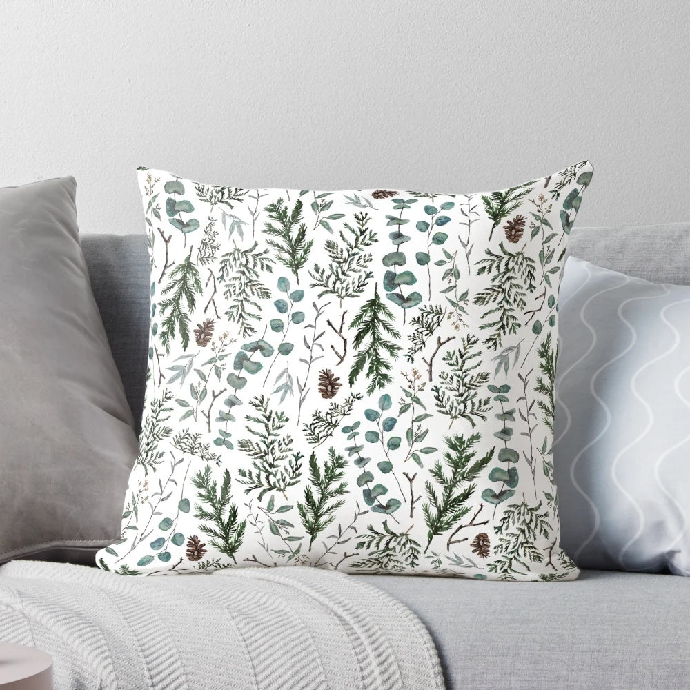 Cozy pine and eucalyptus pillow with watercolor foliage design