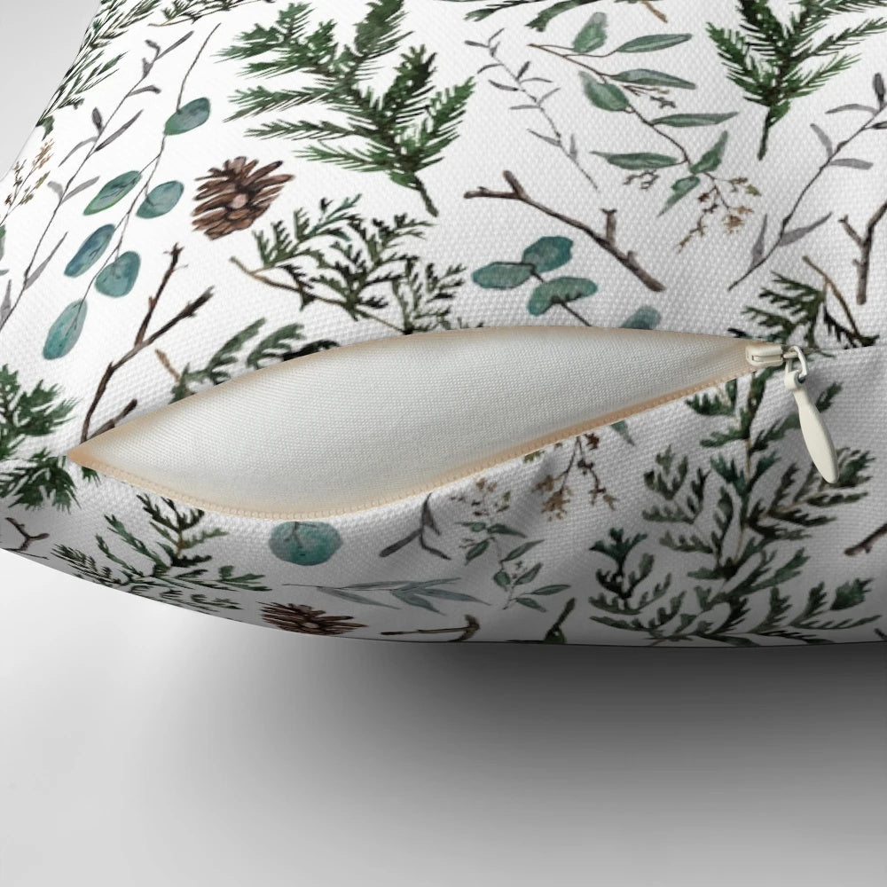 Cozy pine and eucalyptus pillow with watercolor foliage design