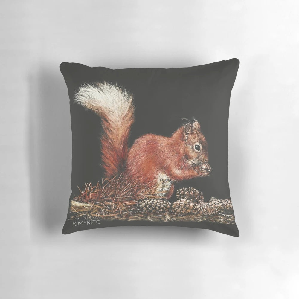 Decorative throw pillow with a squirrel design in a scratchboard style, surrounded by pine cones on a neutral background.