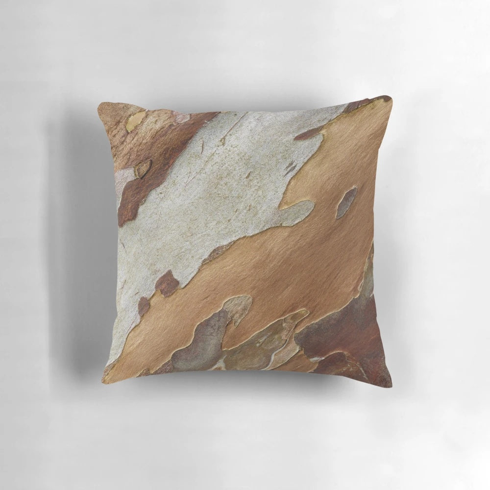 Close-up of a tree bark pattern printed on a decorative pillow