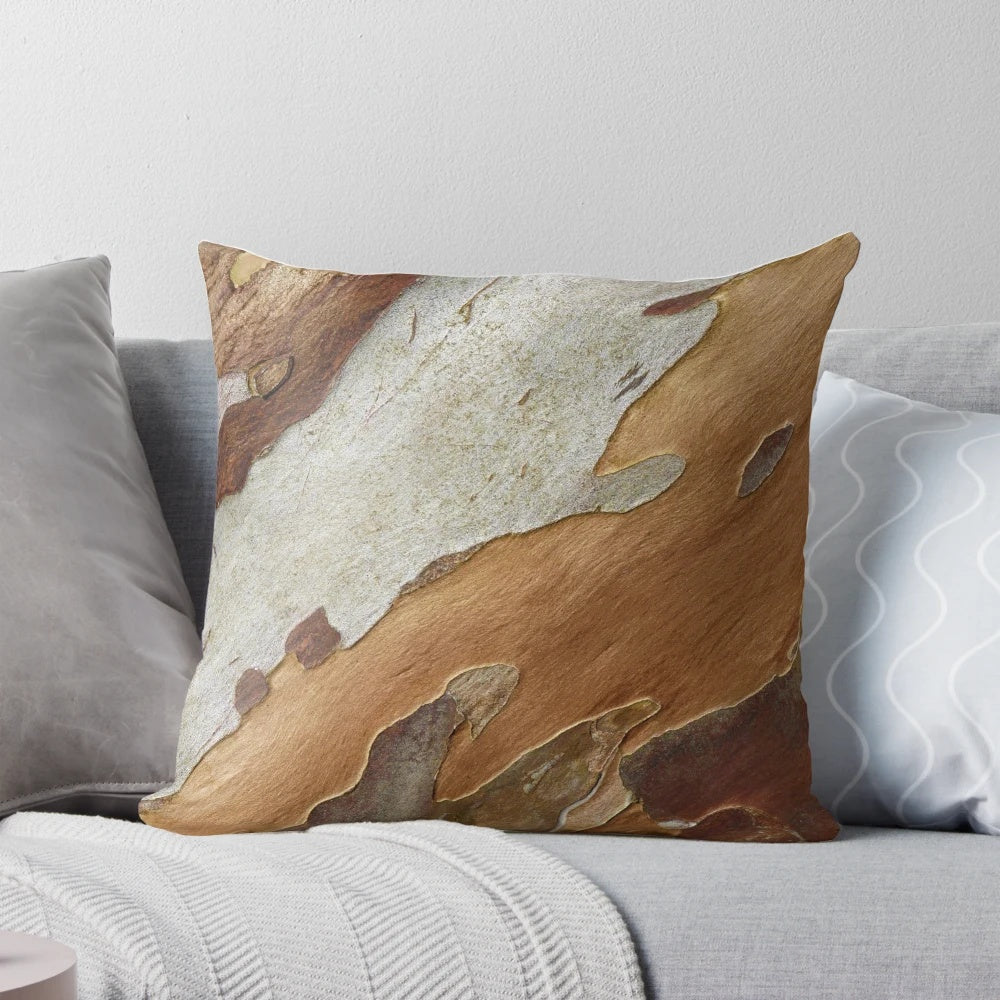 Close-up of a tree bark pattern printed on a decorative pillow