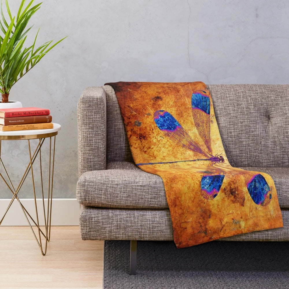 Dragonfly in amber plush blanket with a nature-inspired, distressed design
