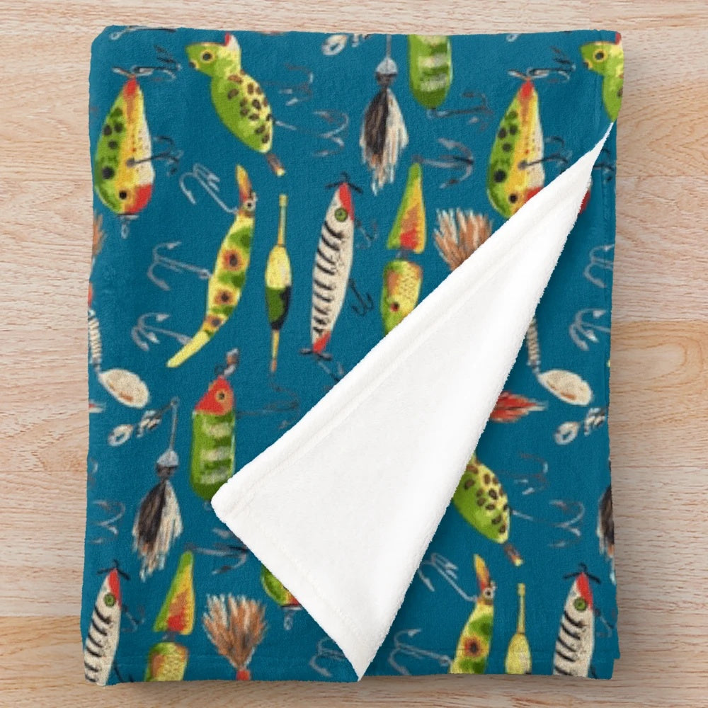 Vintage fishing lures printed on a soft, plush blanket