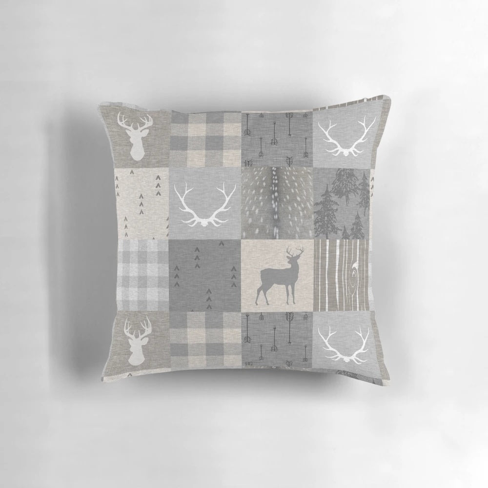 Rustic woodland-themed patchwork pillow in shades of grey and beige