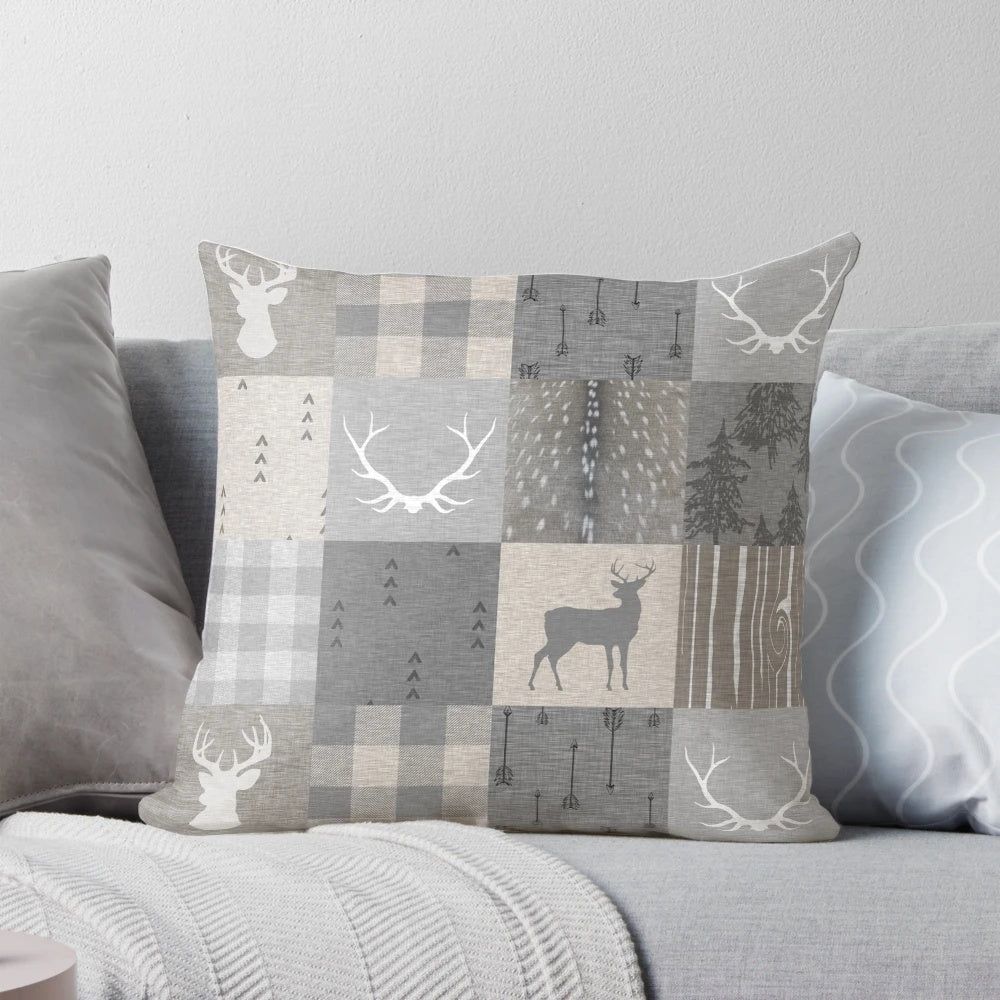 Rustic woodland-themed patchwork pillow in shades of grey and beige
