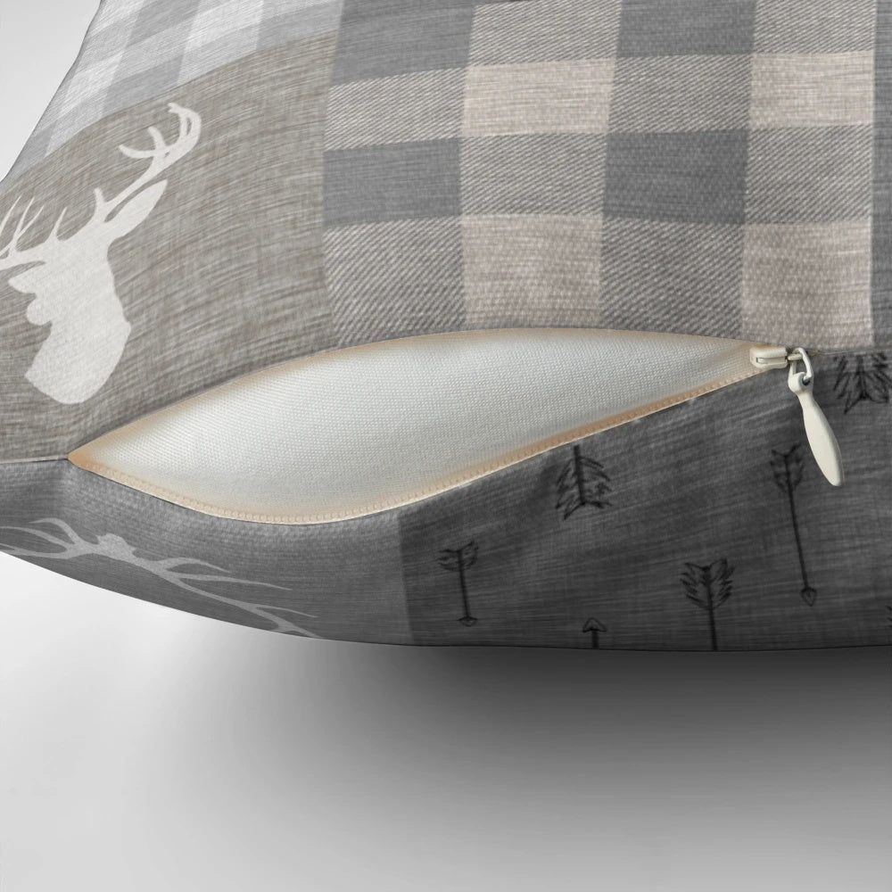 Rustic woodland-themed patchwork pillow in shades of grey and beige