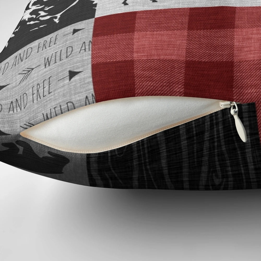 Rustic red and black patchwork pillow with woodland animal motifs, including moose, elk, and deer.