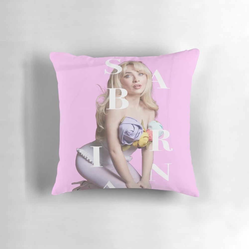 Soft, pink pillow with the name "Sabrina" printed on it, ideal for Sabrina Carpenter fans.