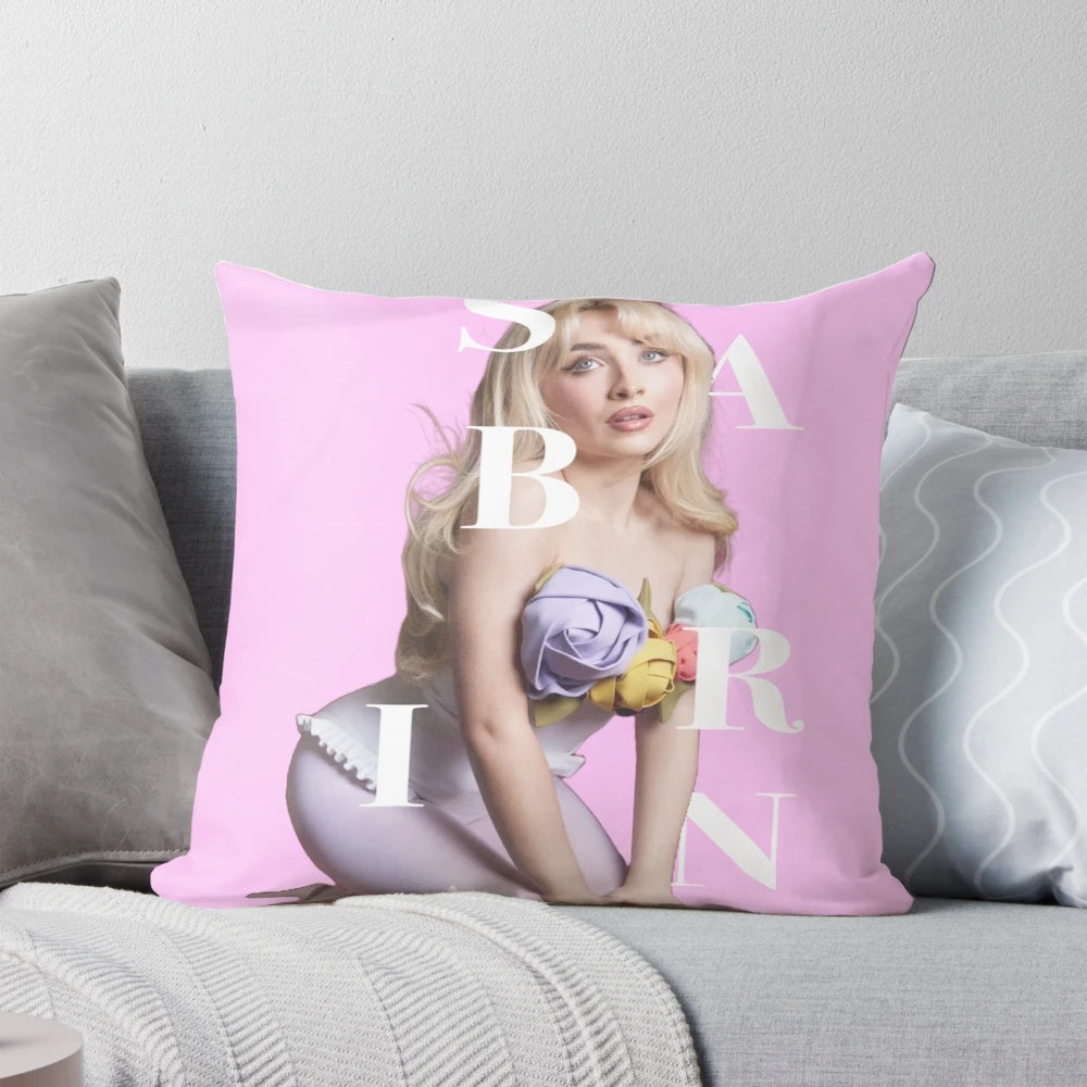 Soft, pink pillow with the name "Sabrina" printed on it, ideal for Sabrina Carpenter fans.