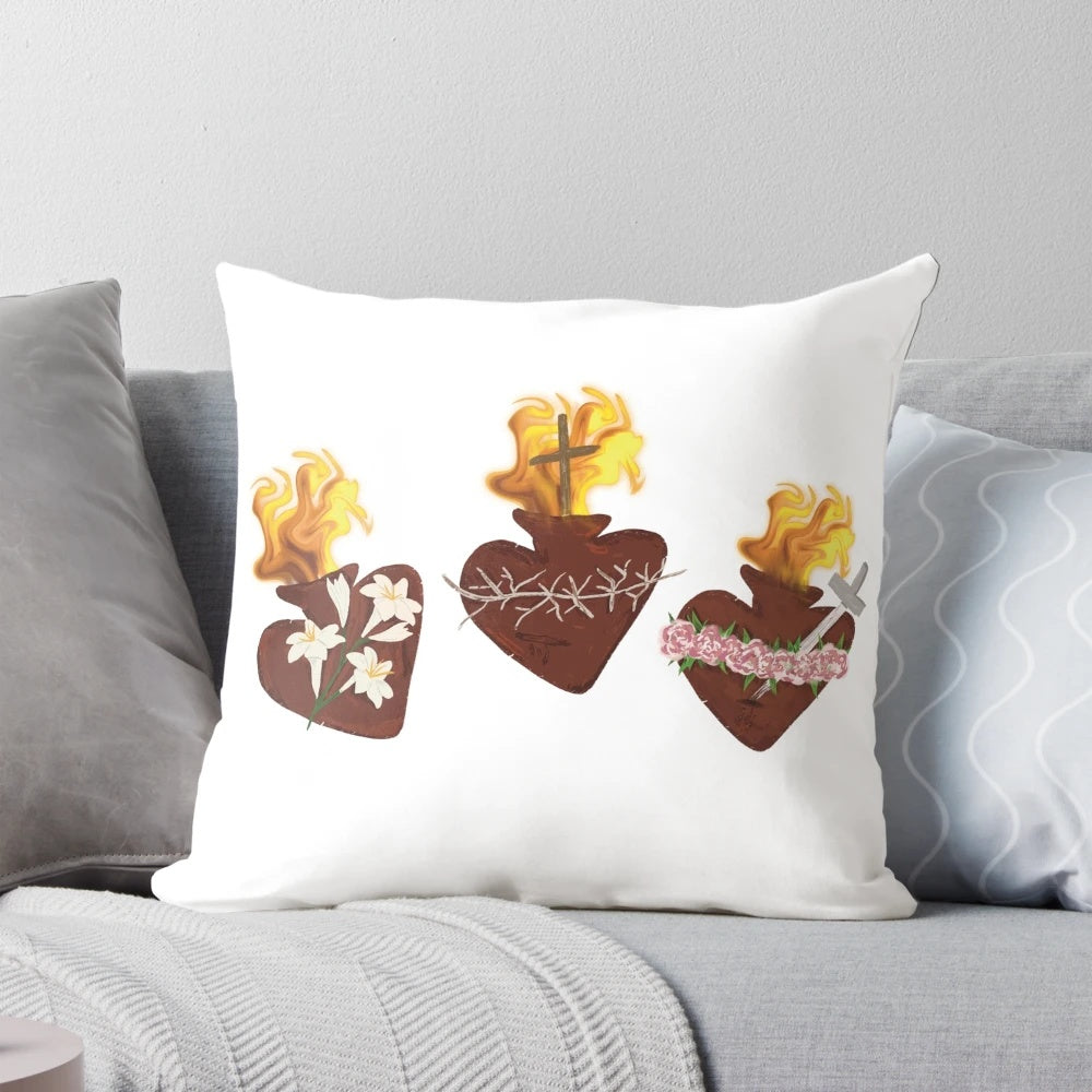 Three hearts pillow with sacred heart, chaste heart, and immaculate heart design